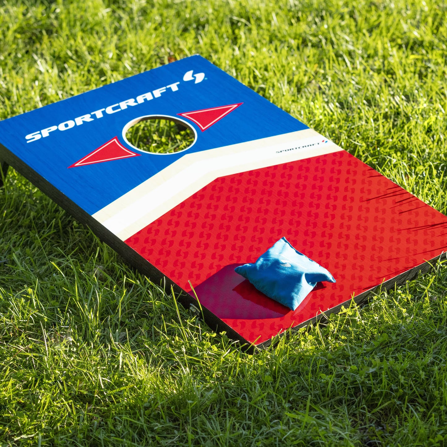 Sportcraft Wooden Corn Hole Bean Bag Toss Lifestyle Image, Target board sitting on grass