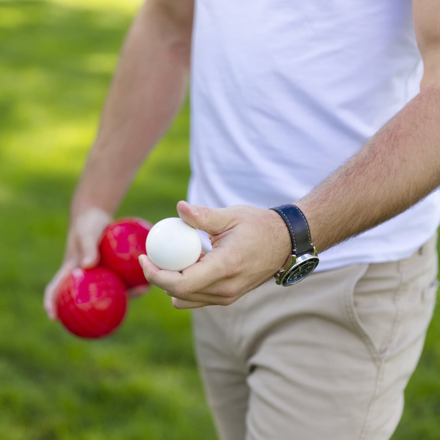 Sportcraft Bocce Ball Set Lifestyle Image, Man holding Bocce balls in hand