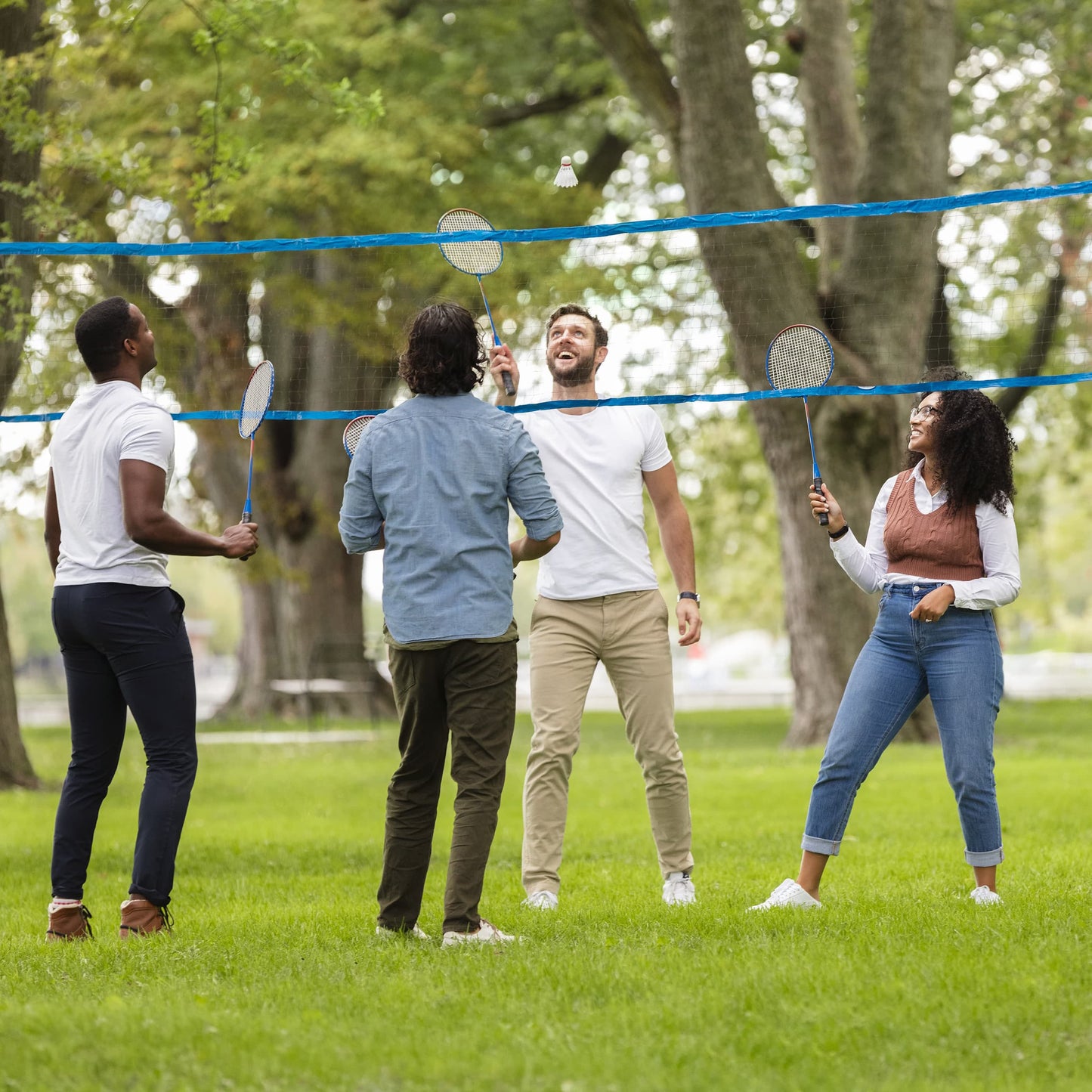 Sportcraft Badminton Volley Ball Set - Lifestyle Image - Group of young adult's playing Badminton in a park