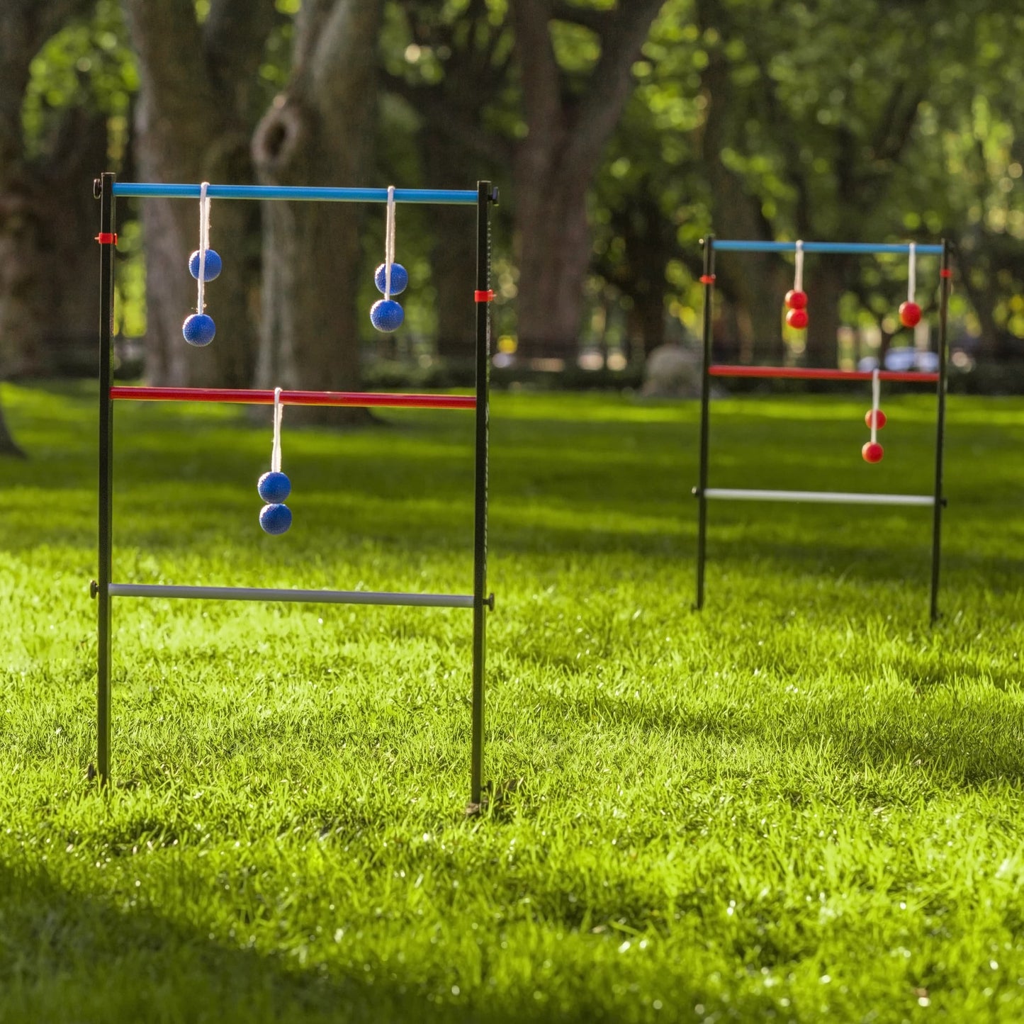 Sportcraft Steel Ladder Toss Lifestyle Image, Ladders sitting on grass in a park, waiting for players
