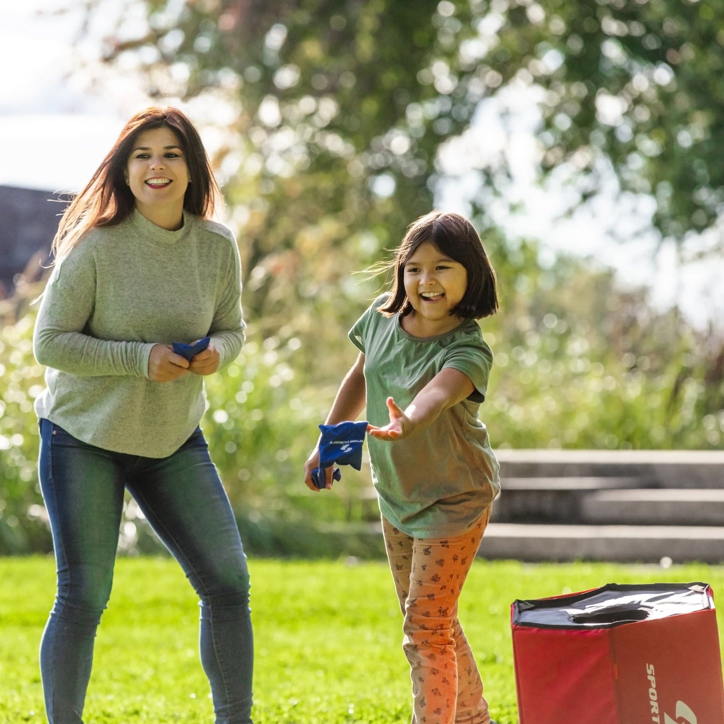 Sportcraft 2-In-1 Folding Disc Slam And Bean Bag Toss Game - Lifestyle Image - Woman & girl playing the game outside