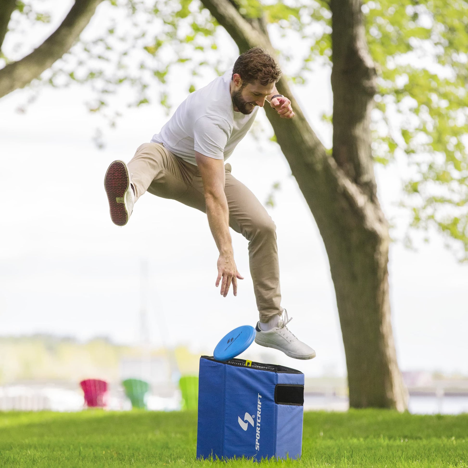 Sportcraft 2-In-1 Folding Disc Slam And Bean Bag Toss Game - Lifestyle Image - Man playing Disc Slam & having fun